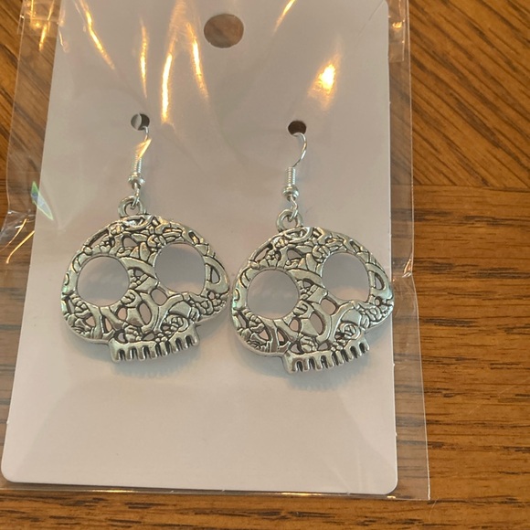 Jewelry - “sterling silver Skull” earrings.